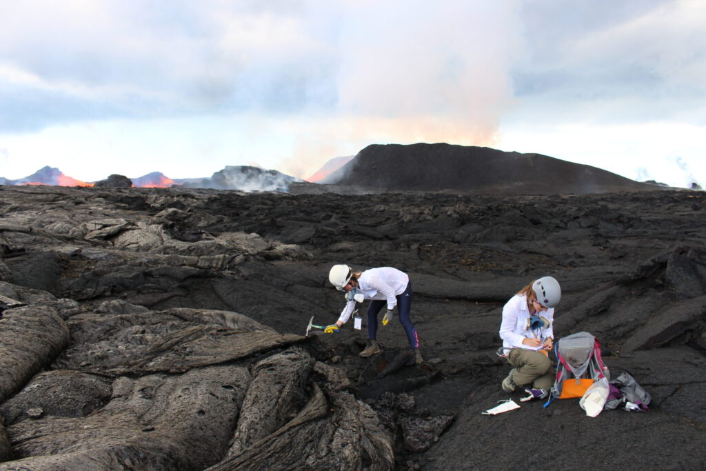 Penny Wieser and Emily Mason hammering at Fissure 8