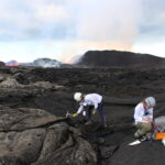 Penny Wieser and Emily Mason hammering at Fissure 8